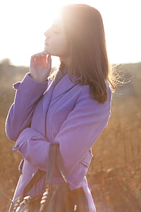 woman wearing purple trench coat thumbnail