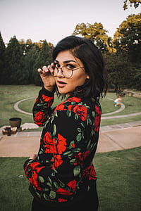 woman wearing black and red floral long-sleeved dress thumbnail