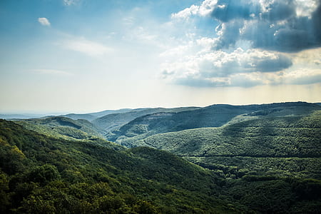 Green Tree Coated Mountain Under White and Blue Cloudy Sky at Daytime thumbnail