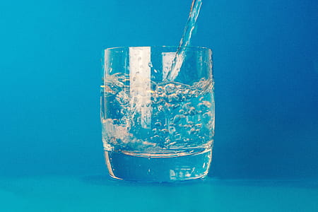 water pouring on clear glass cup thumbnail