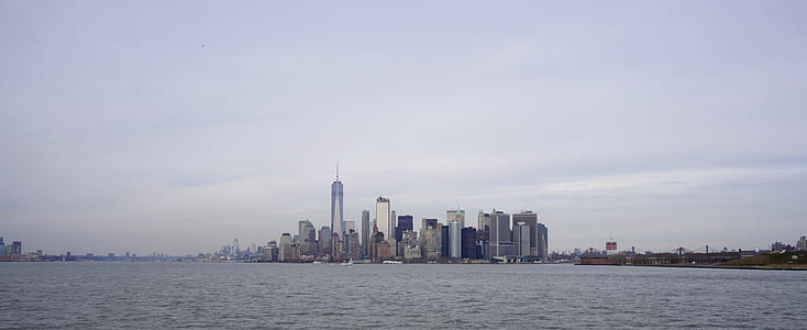 high-rise buildings near body of water thumbnail