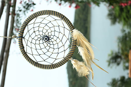selective focus photography of beige dreamcatcher thumbnail
