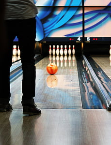 man standing on bowling court thumbnail