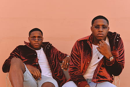 two men sitting on bench wearing velvet jackets thumbnail