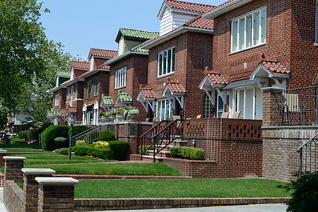 brown houses near green tree thumbnail