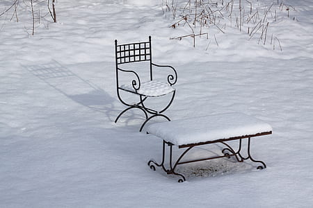 snow-covered black metal bench and armchair thumbnail