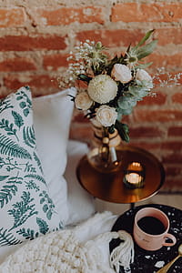 A lovely woman's bedroom with a beautiful bouquet of flowers thumbnail