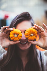 woman holding two small squash thumbnail