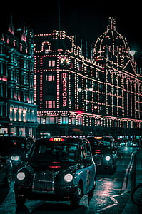 black hatchback running on road during nighttime thumbnail