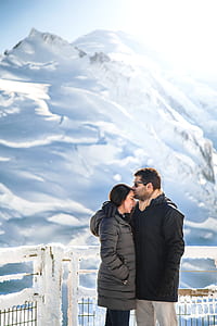man kissing woman on forehead thumbnail