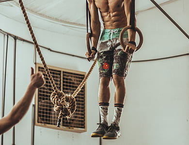 man holding on rings thumbnail