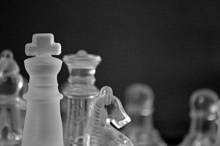 clear glass horse chess piece beside king thumbnail
