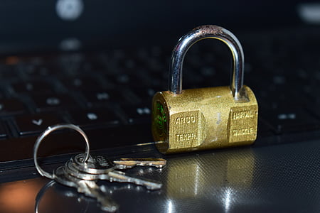 selective focus photography of padlock and keys thumbnail