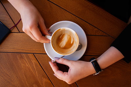 Person Holding Ceramic Mug thumbnail