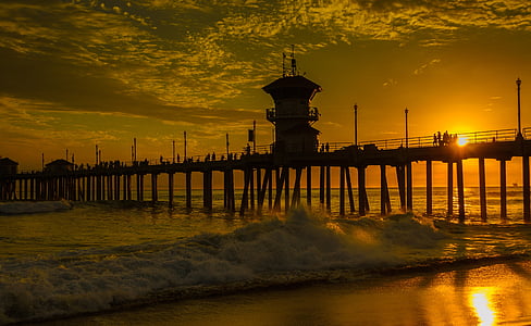 dock on seashore during sunset thumbnail