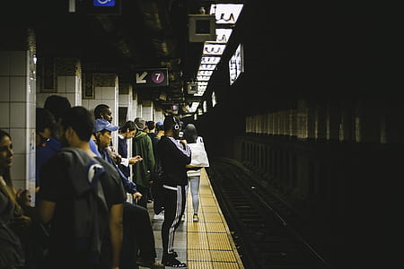 people standing inside a train station thumbnail