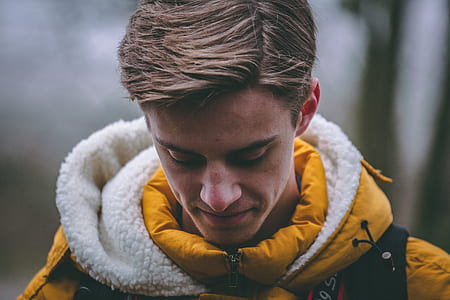 photo of man wearing yellow and white zip-up hooded jacket thumbnail