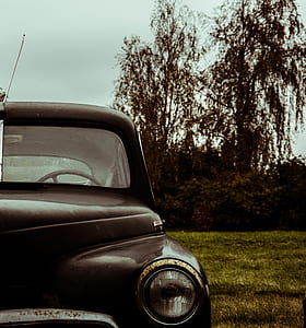 close up photography of black truck during daytime thumbnail