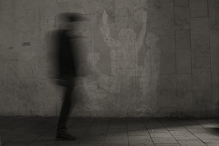 time lapse photo of man walking on pathway thumbnail