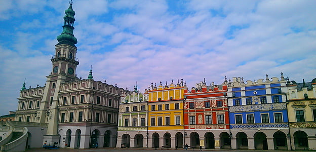 multicolored concrete building under white sky thumbnail