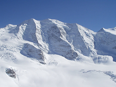 photo of snow covered mountain under blue sky thumbnail