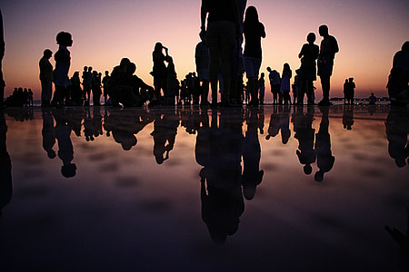 silhouette of people during orange sunset thumbnail