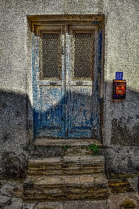 closed blue wooden door thumbnail