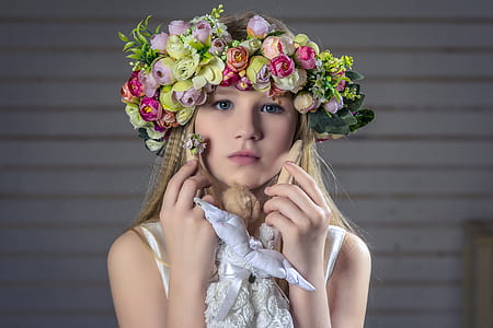 woman in green and pink petaled flower headdress thumbnail