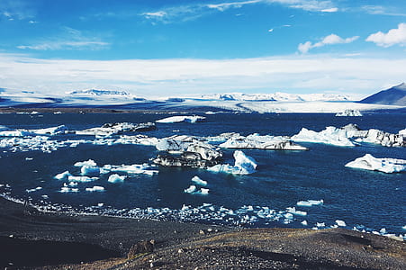 icebergs on ocea water during daytime thumbnail