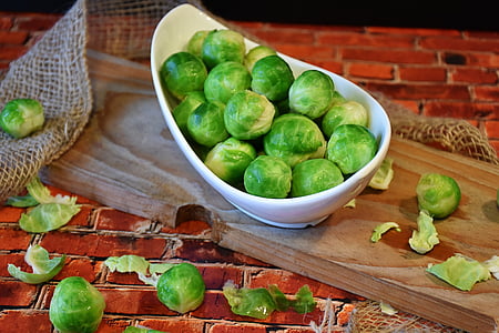 round green fruits on white ceramic bowl thumbnail
