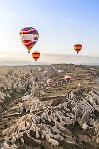 hot air balloon flying on the sky under blue sky thumbnail