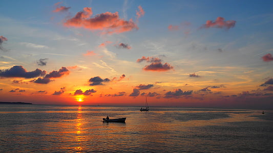 man sailing under blue sky thumbnail
