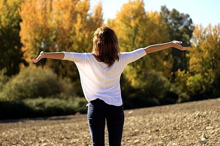 woman in white elbow-sleeve blouse and black fitted jeans thumbnail