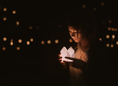 woman holding white light thumbnail