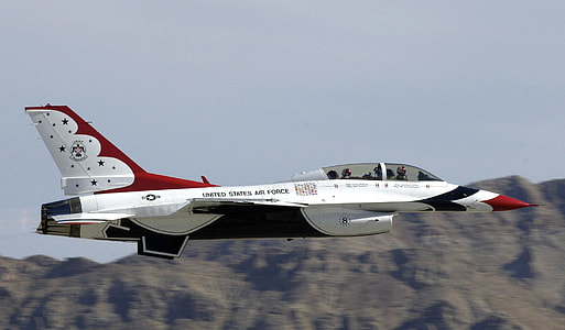 white and red jet on flight thumbnail