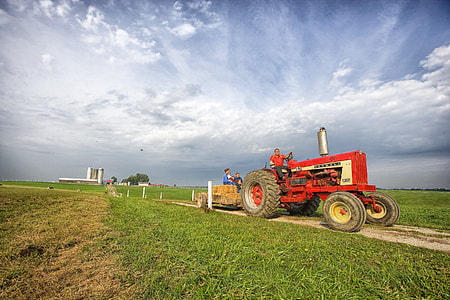 red and white farm tractor thumbnail