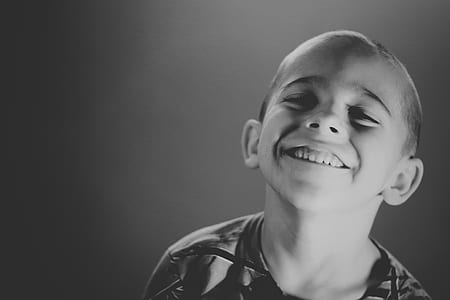 greyscale photo of smiling boy thumbnail
