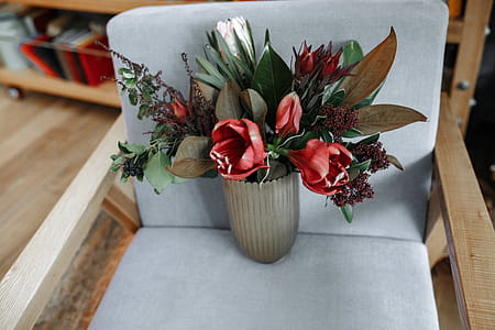 Red Tulip Flowers in Vase on Armchair thumbnail