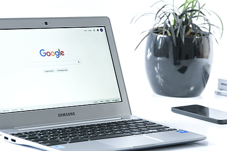 turned-on Samsung laptop with Google search bar display thumbnail