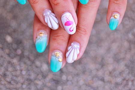 woman with pink and blue nail arts thumbnail