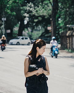 Shallow Focus Photography of Woman in Black Sleeveless Top thumbnail