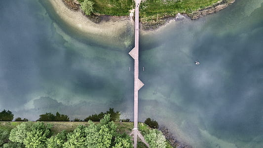 aerial view photography of gray bridge over body of water at daytime thumbnail