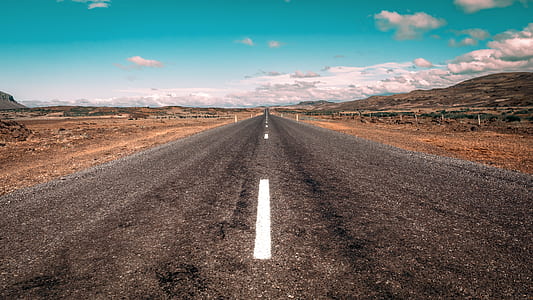 photo of concrete road under clear blue sky thumbnail