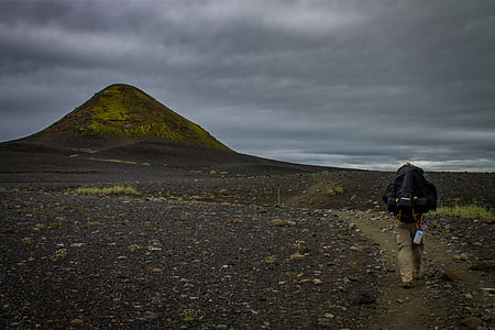 person walking towards mountain thumbnail