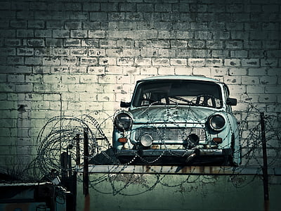 gray car parked in front wall thumbnail