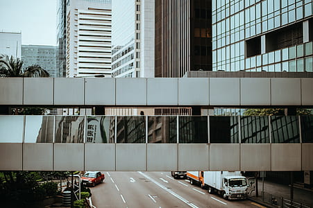 person showing white concrete building thumbnail