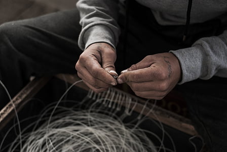 person holding needle thumbnail