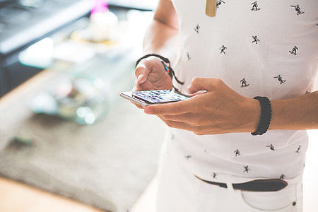 Man Working on iPhone while Walking thumbnail