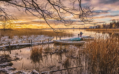 two one and one teal canoe near dock thumbnail
