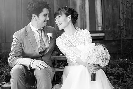 smiling man and woman facing each other while sitting thumbnail